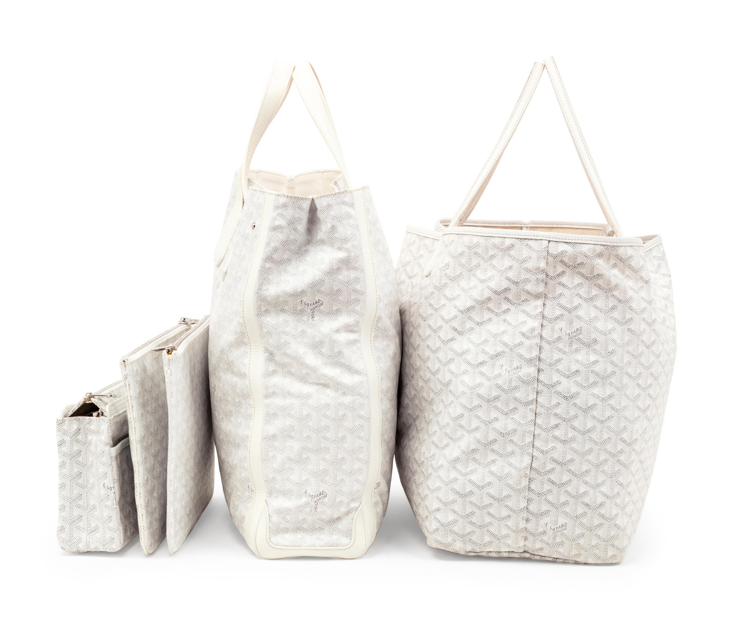 Six Goyard Items: Two Totes, Three Pouches, and One Wallet