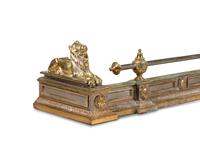 An Empire Style Brass and Steel Fire Fender with Recumbent Lions