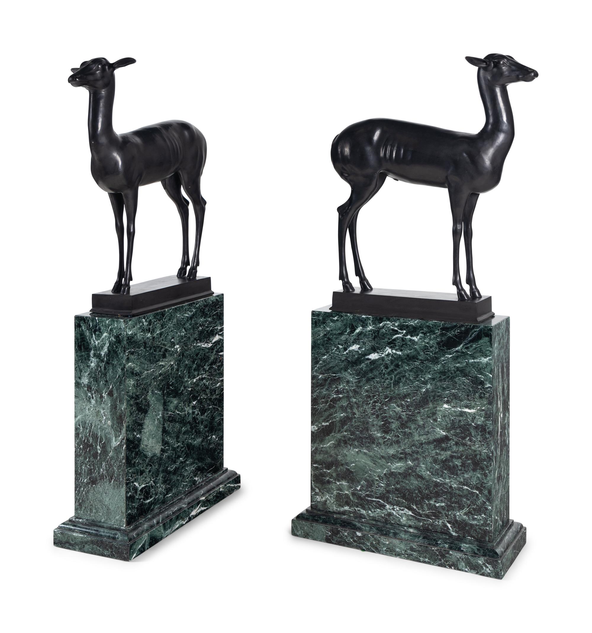 A Pair of Bronze Models of Pompeiian Deer on Marble Plinths