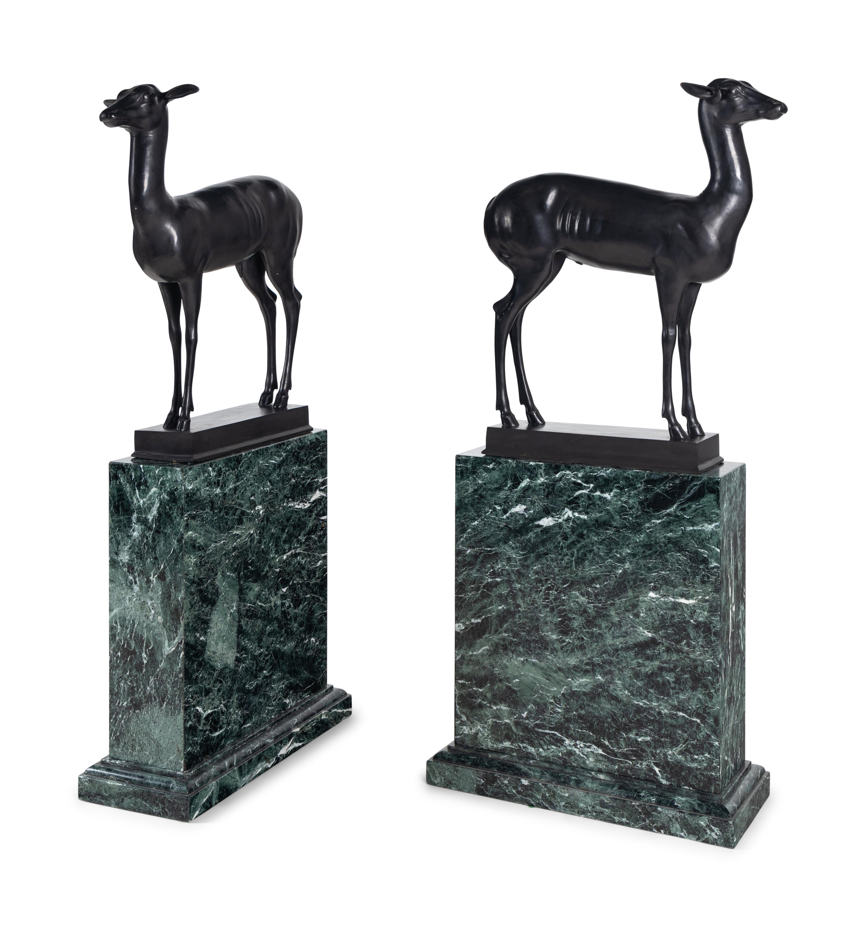 A Pair of Bronze Models of Pompeiian Deer on Marble Plinths