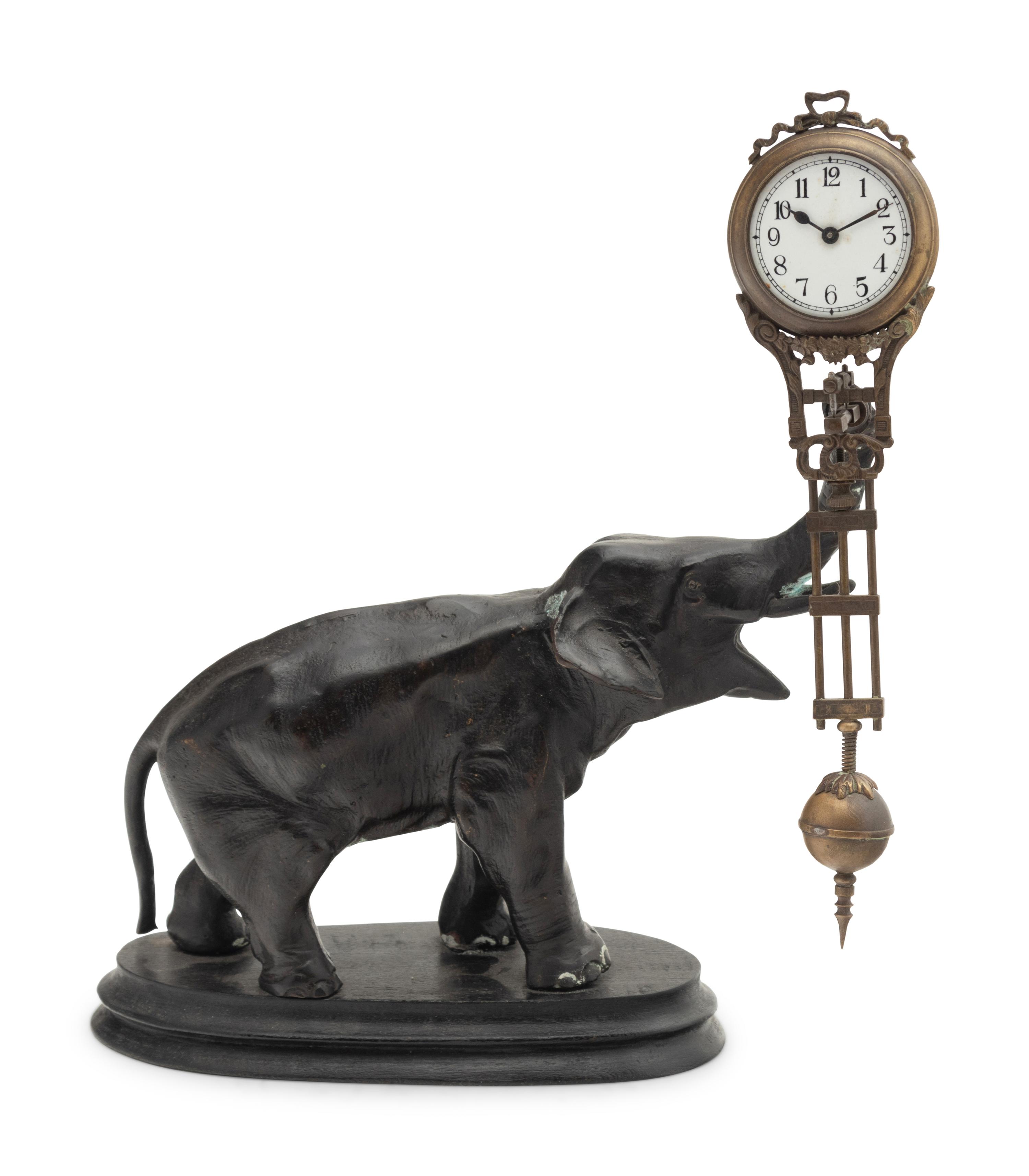 A Continental Cast Metal Elephant-Form Swinging Clock