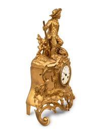 A French Gilt Metal Figural Clock — LATE 19TH CENTURY