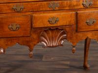 A Queen Anne Shell-Carved and Figured Maple Flat-Top High Chest of Drawers