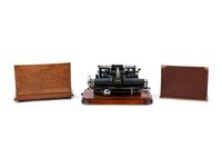 A Postal No. 5 Typewriter with a Wood Case
