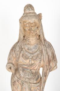 A Chinese Carved Stone Standing Guanyin Figure with Remnants of Polychrome Decoration