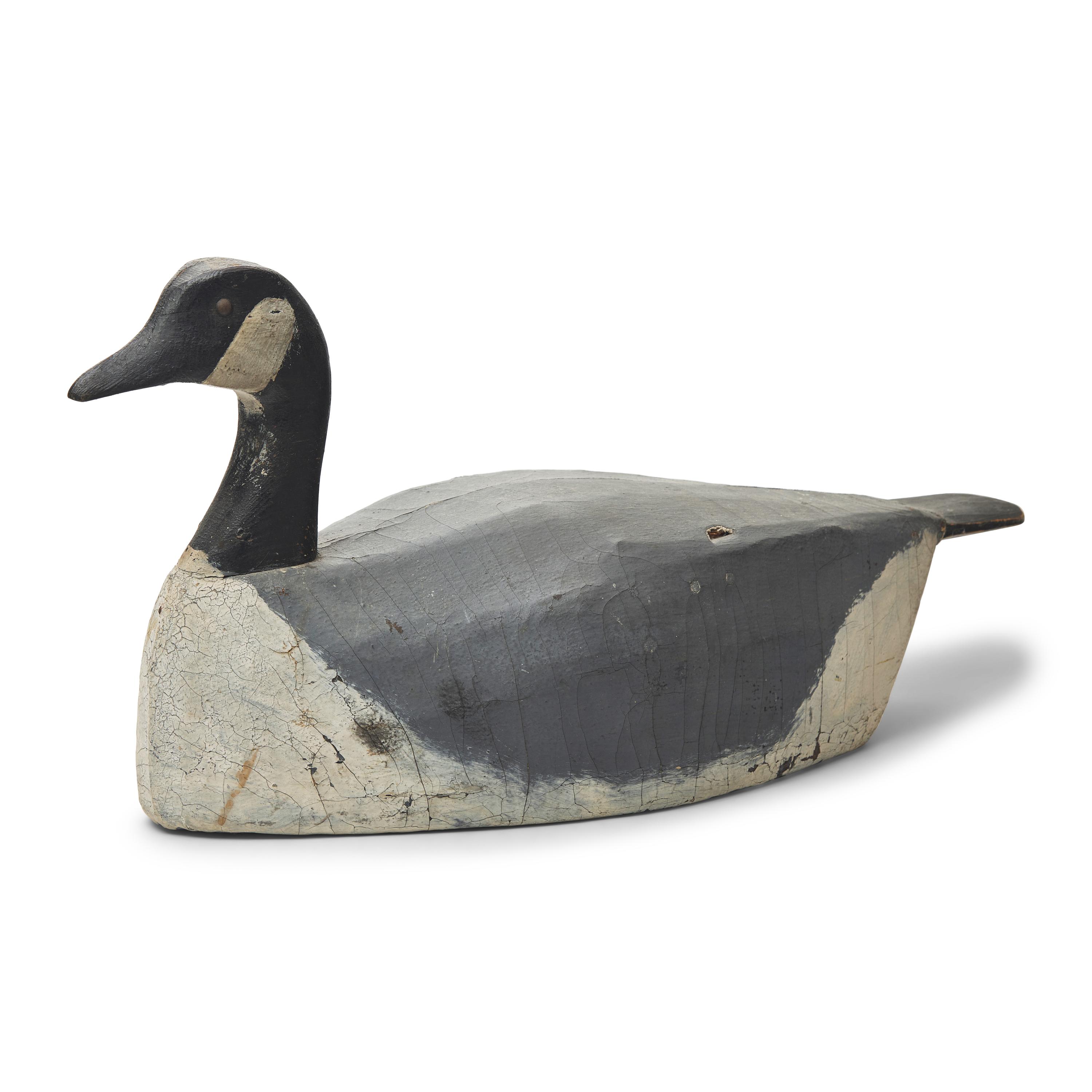 A Carved and Painted Wood and Canvas Canada Slat Goose Decoy