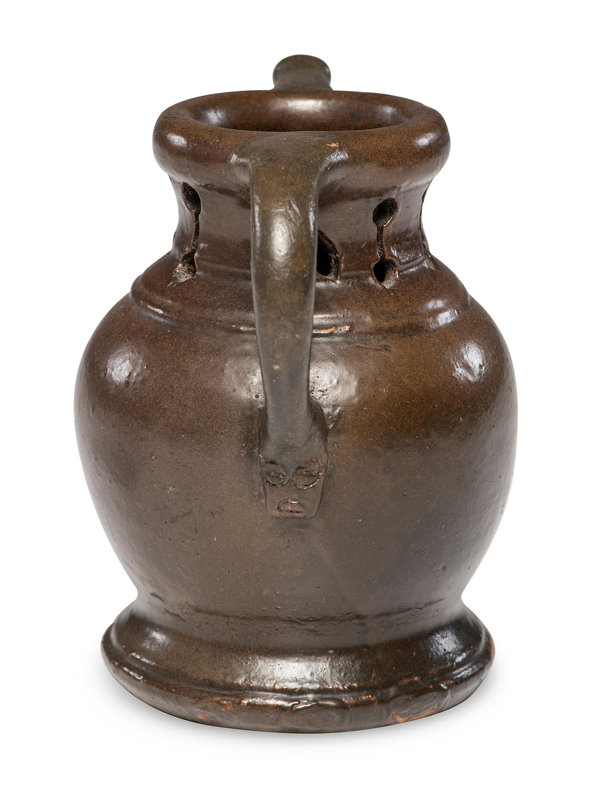 A Rare William Rowley Slip-Glazed Puzzle Jug