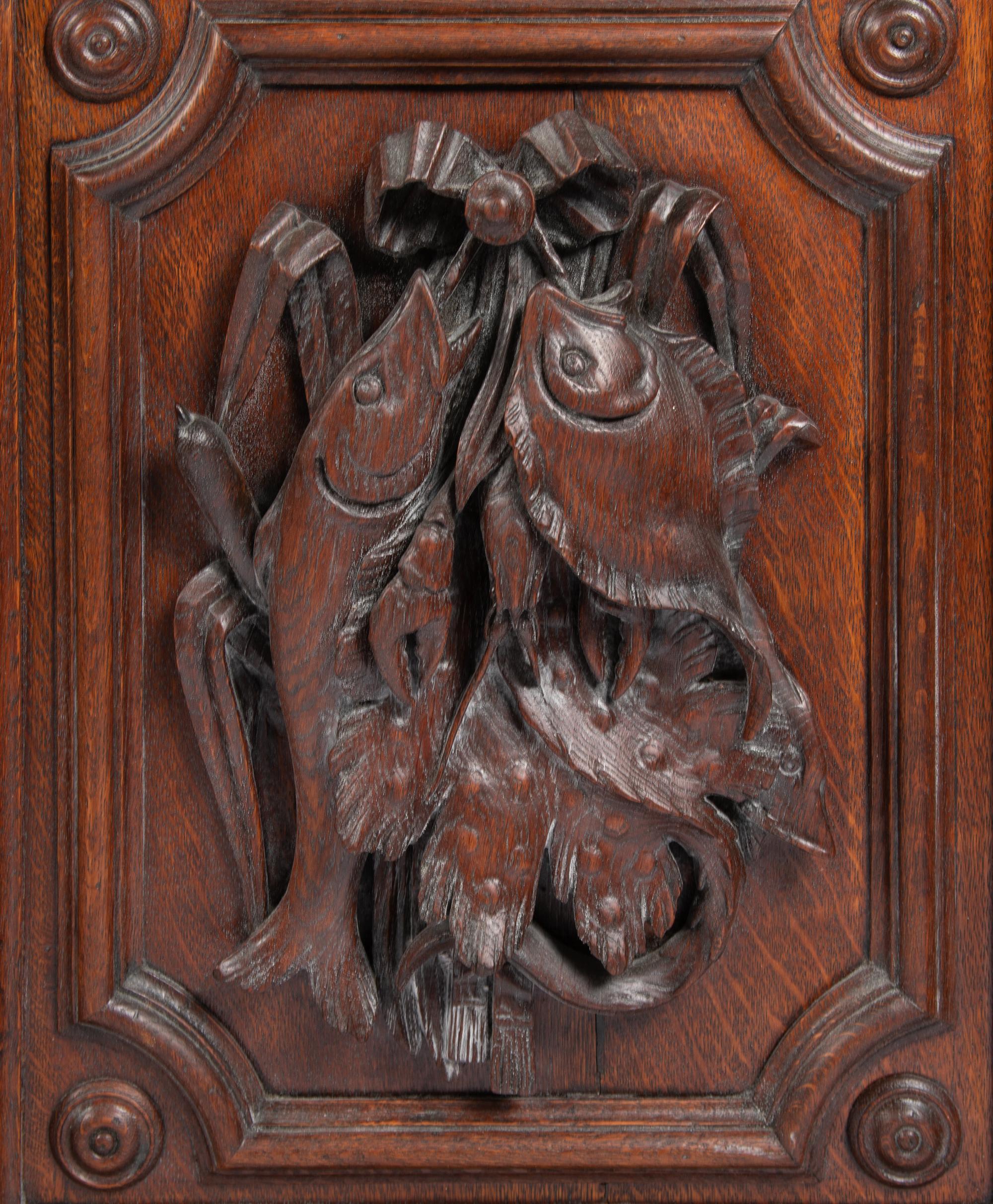 A Continental Carved Oak Cabinet