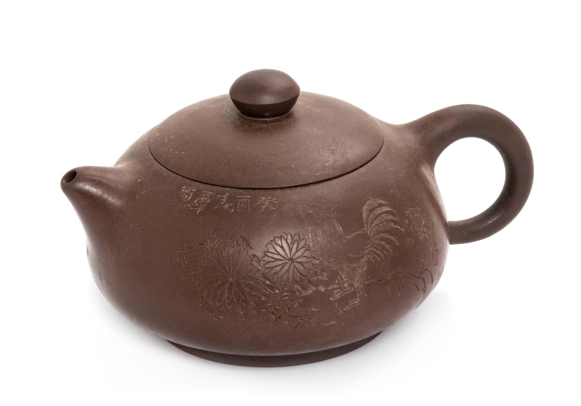 A Chinese Yixing Pottery Teapot Height 3 1/2 inches. — 20TH CENTURY