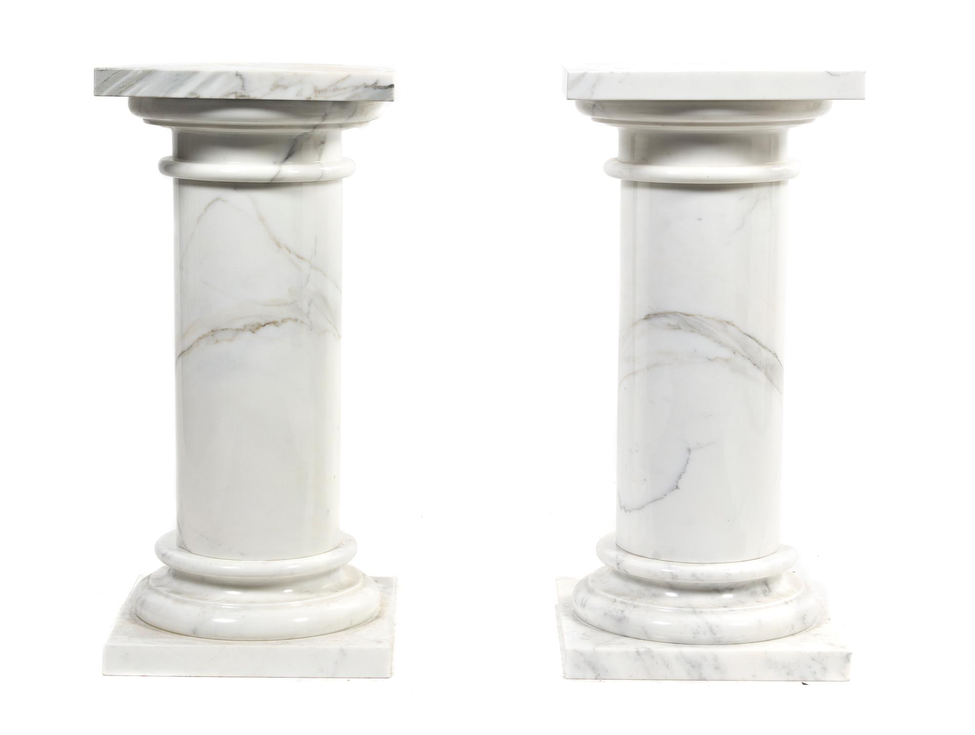 A Pair of White Marble Pedestals, Height overall 29 1/2 inches.