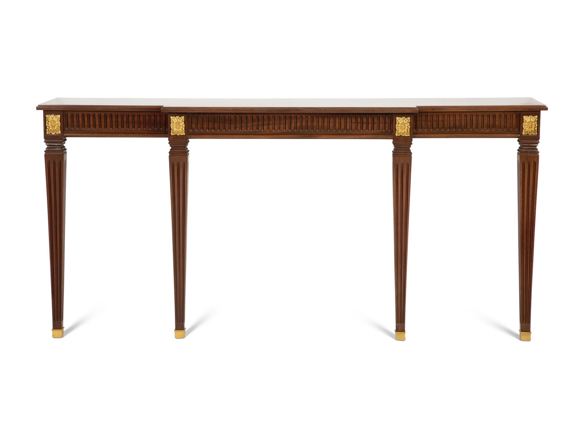 A Louis XVI Style Parcel Gilt Mahogany Console Table