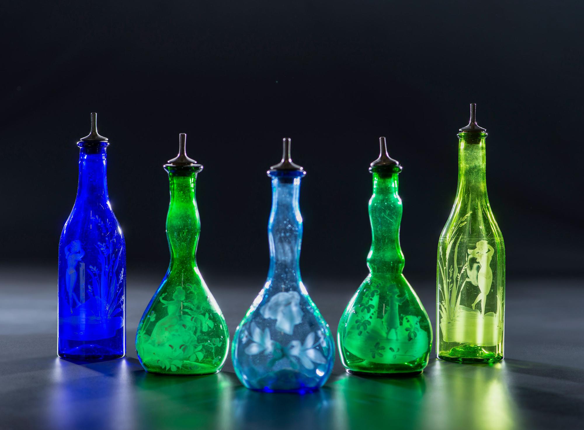 Five Green and Cobalt 'Mary Gregory' Glass Barber Bottles