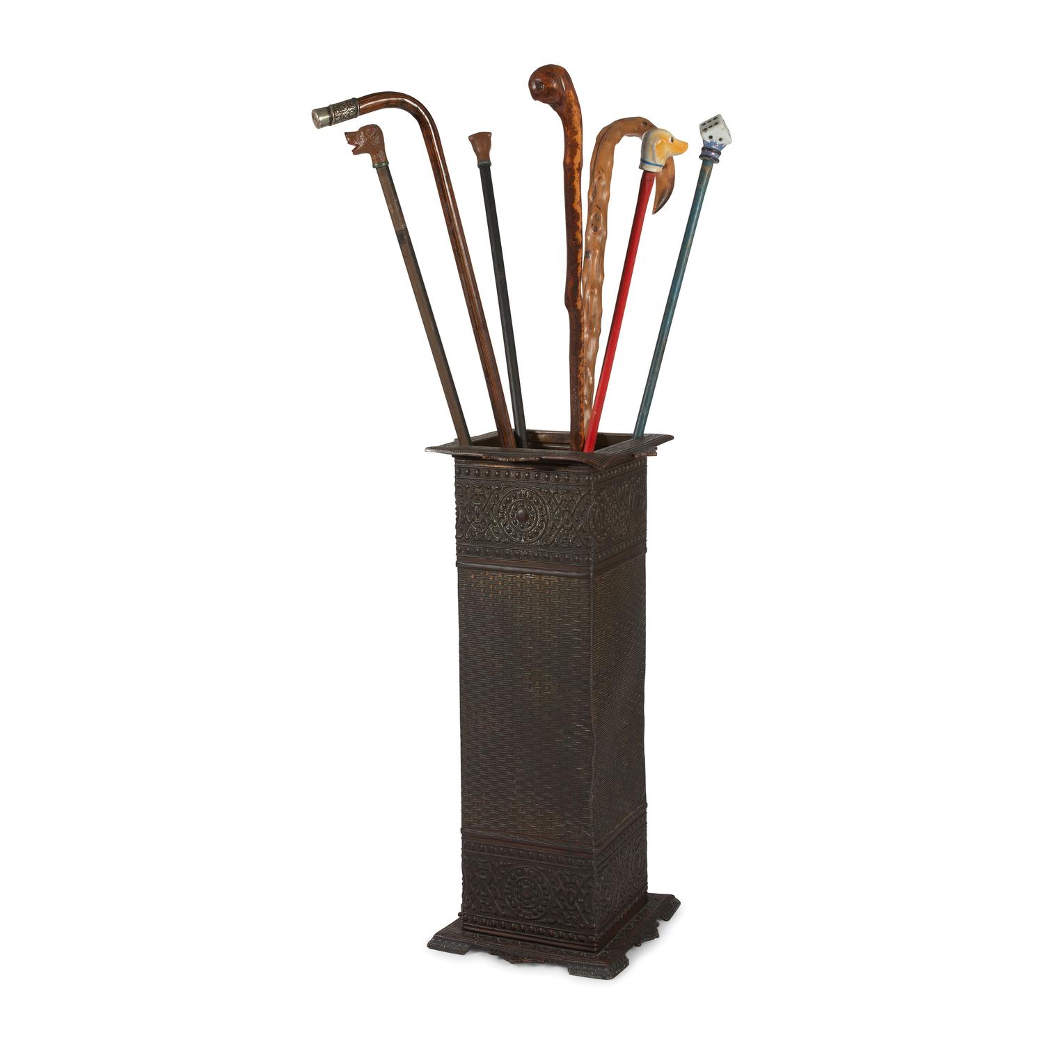 Seven Walking Sticks and a Cast Metal Umbrella Stand