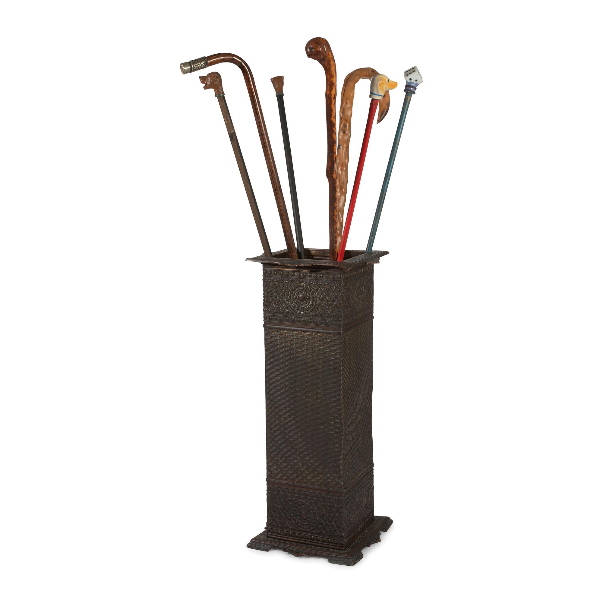 Seven Walking Sticks and a Cast Metal Umbrella Stand