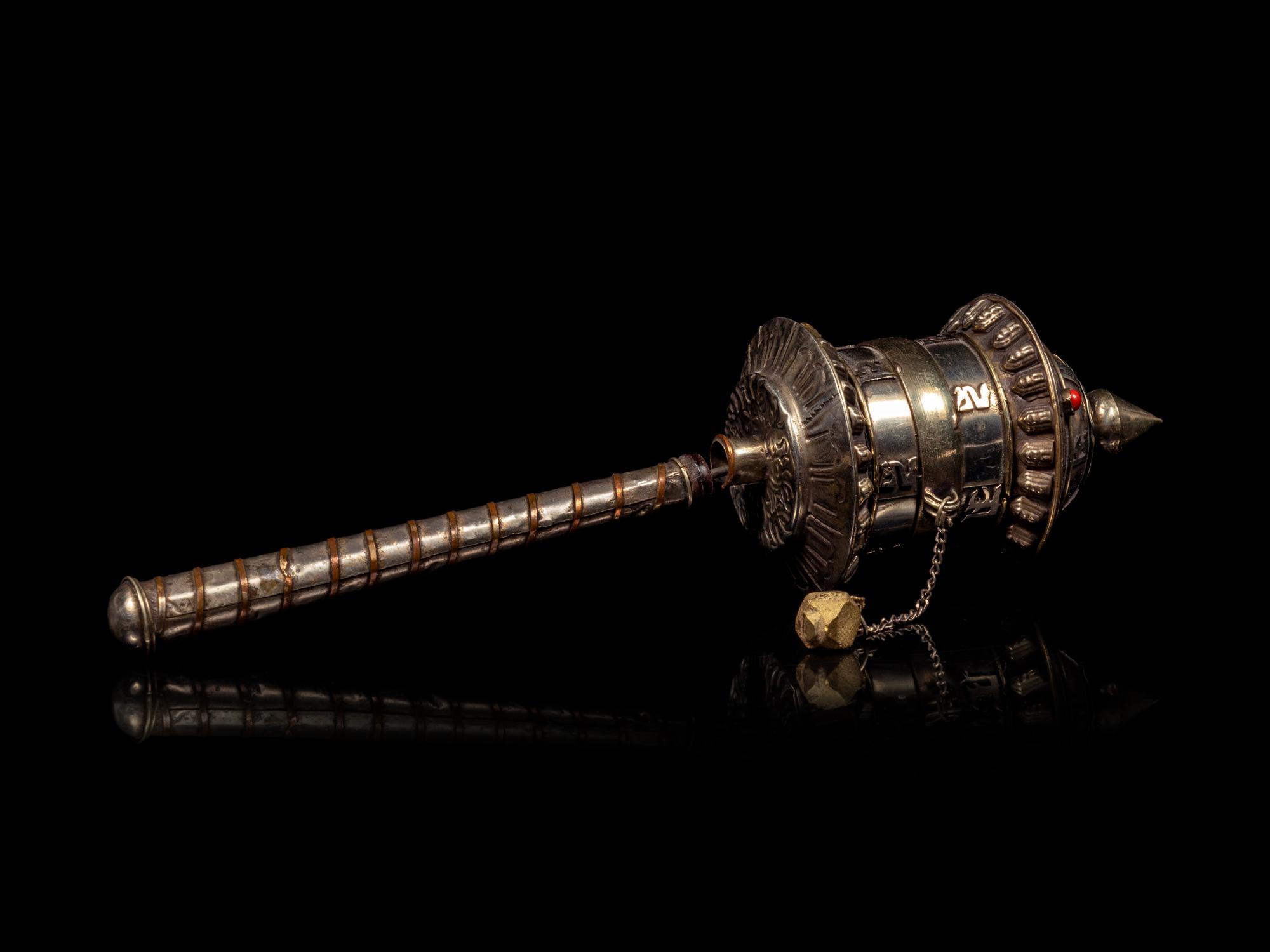 A Tibetan Silver Praying Wheel