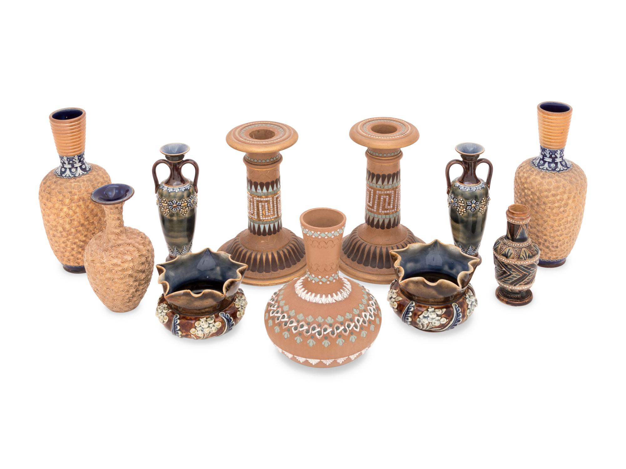 A Group of Doulton Lambeth Stoneware Vases and a Pair of Candlesticks