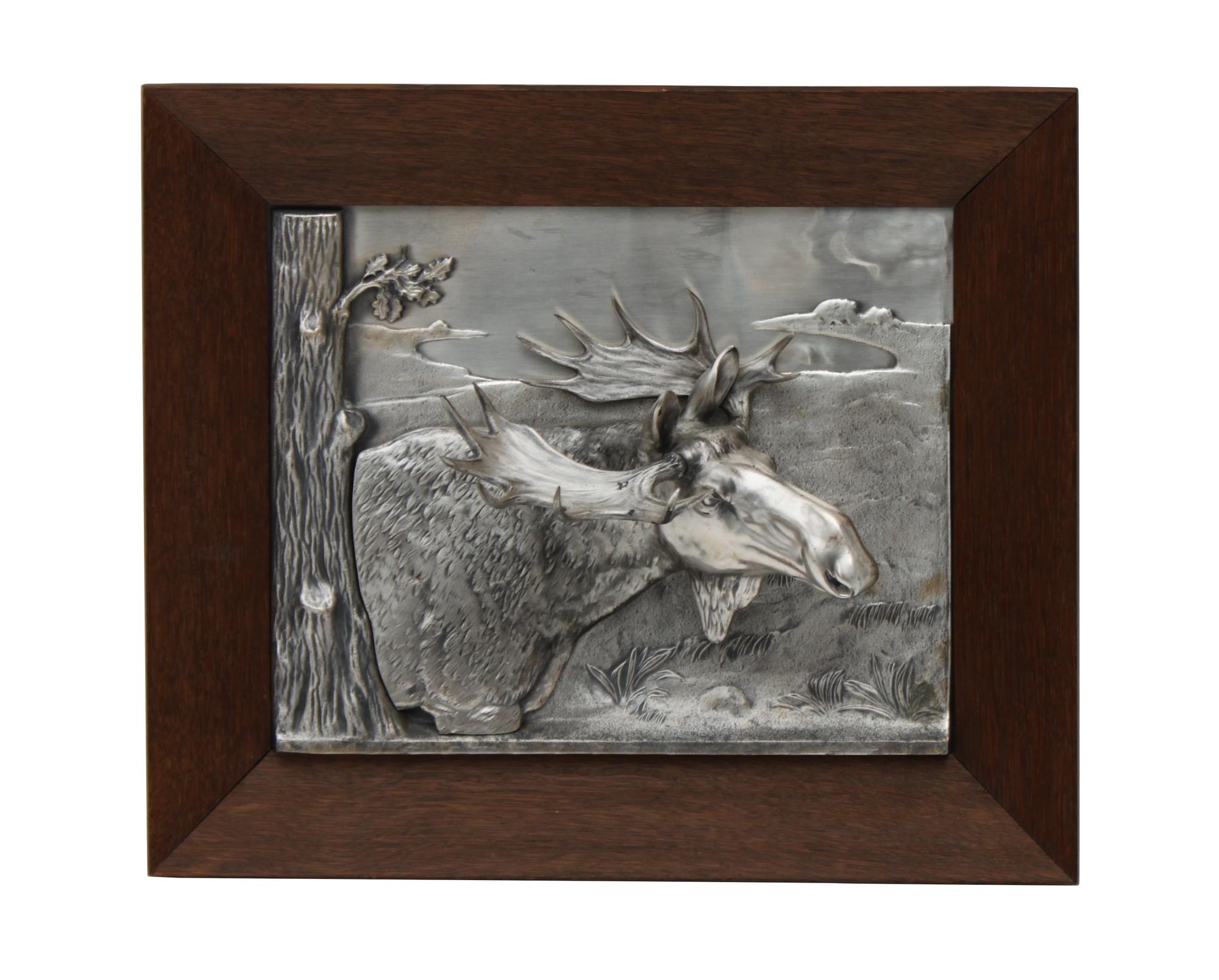 A Decorative Tin Relief of a Moose Height 14 1/2 x width 17 inches