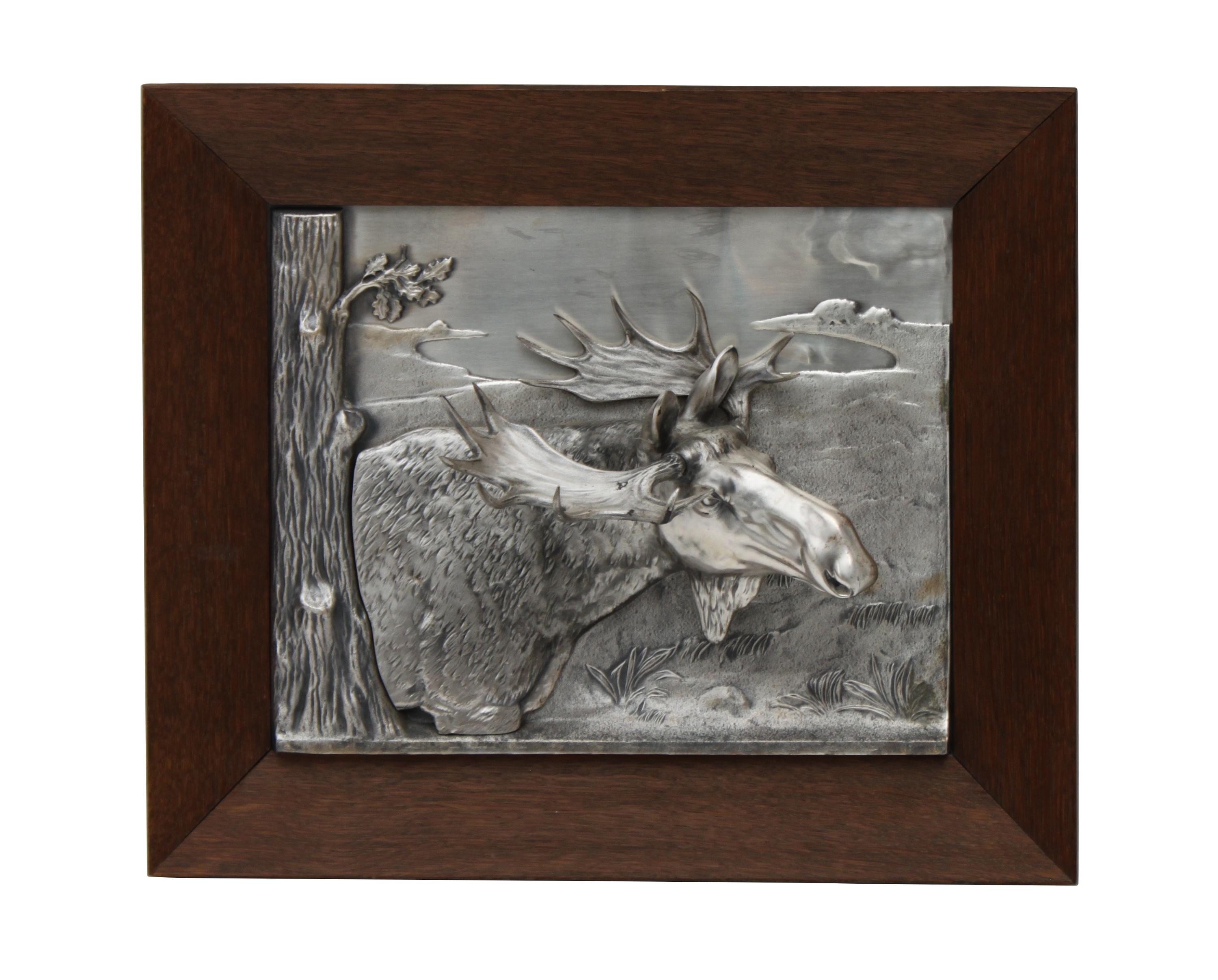 A Decorative Tin Relief of a Moose Height 14 1/2 x width 17 inches