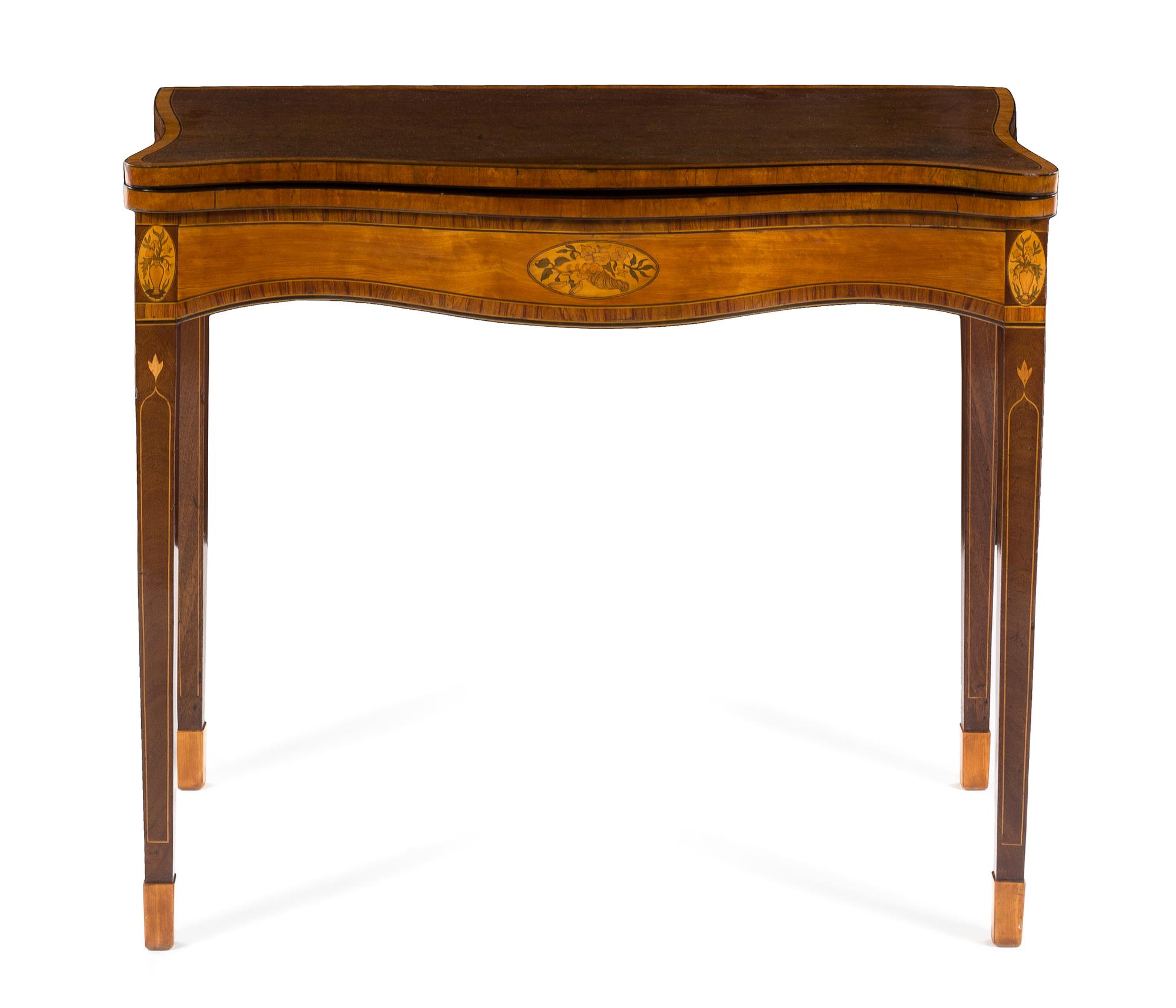 A George III Marquetry and Satinwood Inlaid Mahogany Game Table Height 29 1/2 x width 34 3/4 x depth 14 3/4 inches (closed). — LATE 18TH CENTURY