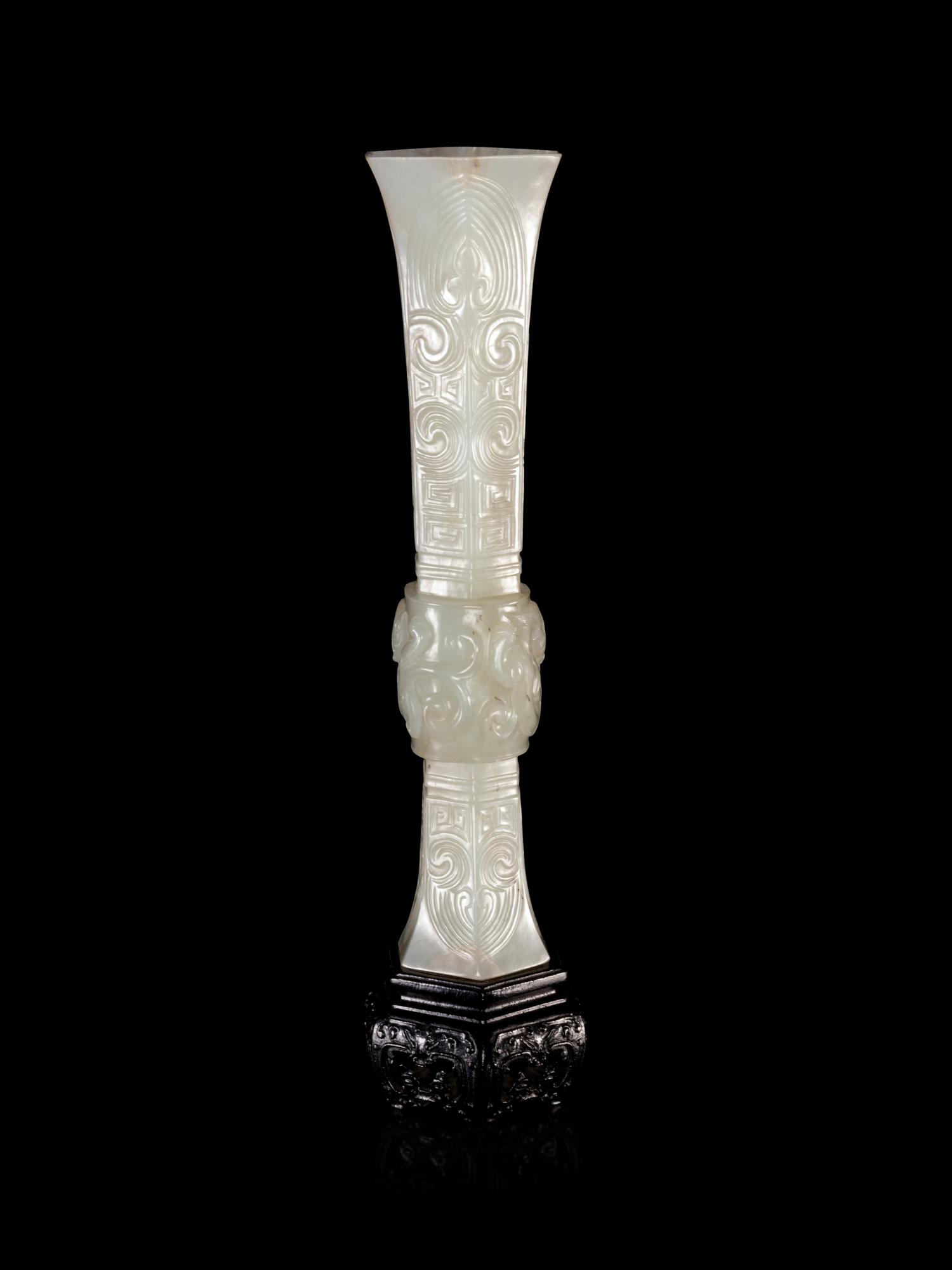 A Carved White Jade Gu Vase
