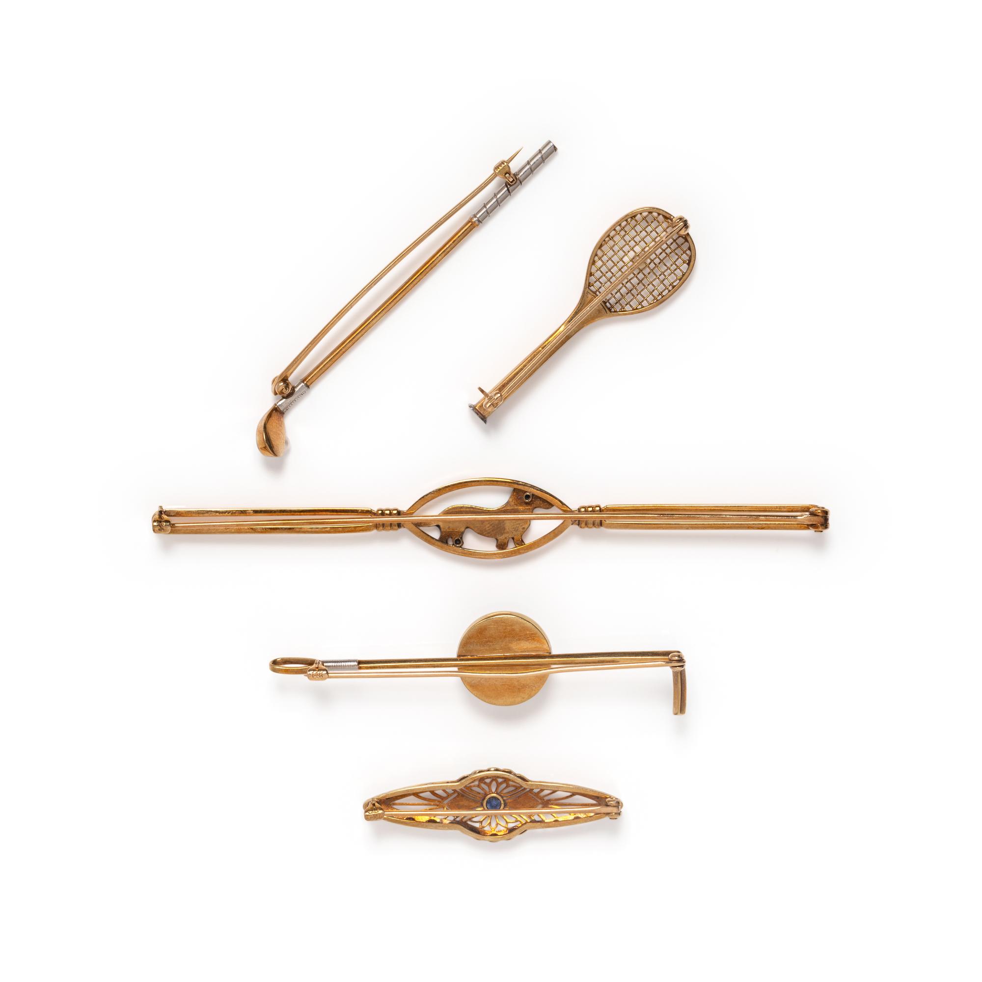 COLLECTION OF GOLD BROOCHES