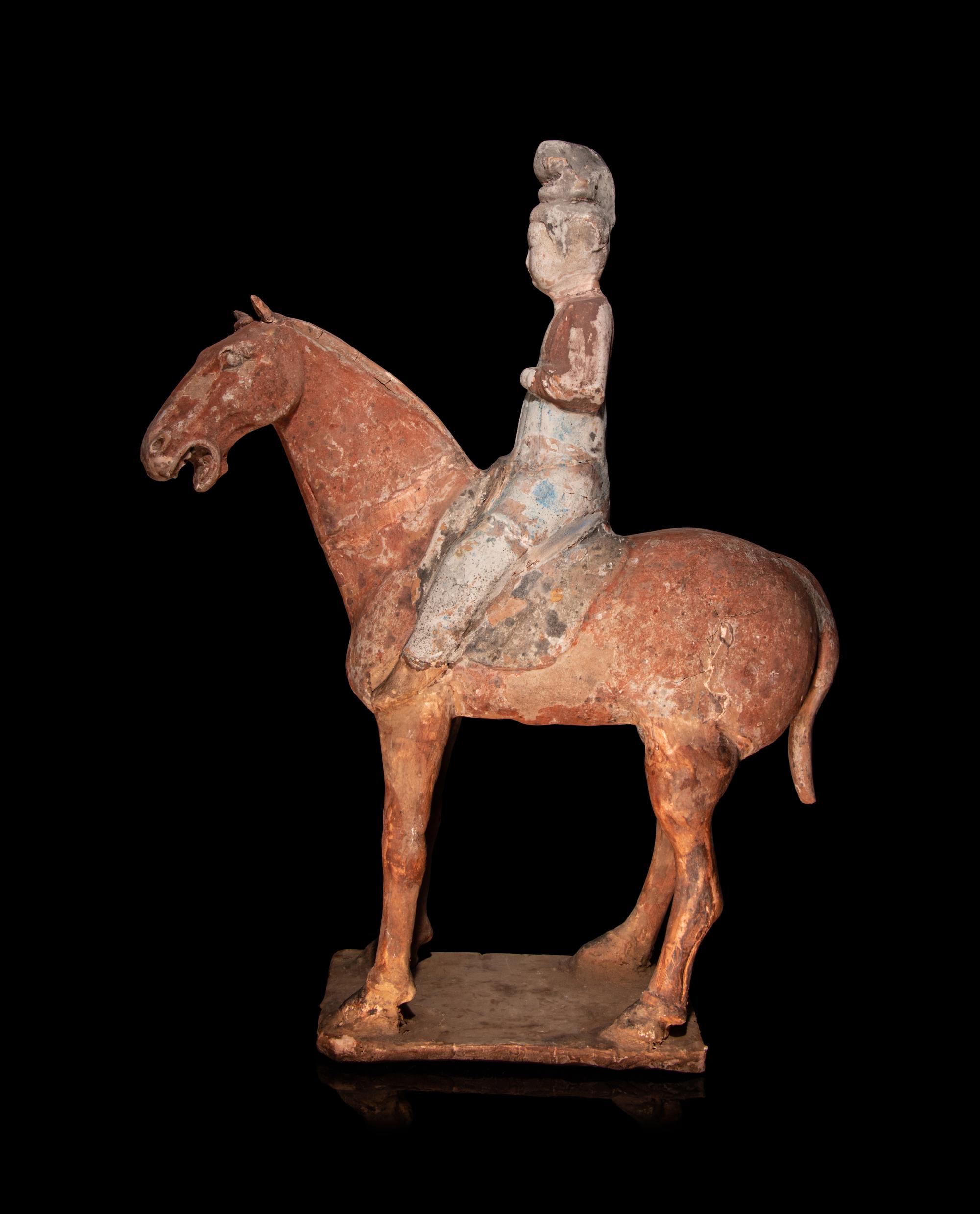 A Pair of Chinese Pottery Equestrian Figures