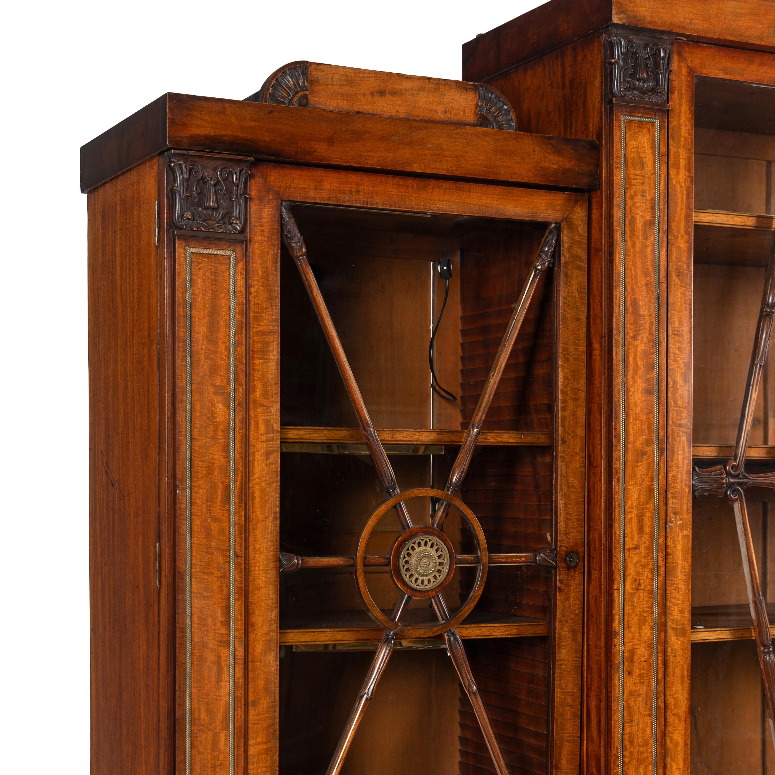 A Regency Mahogany, Ormolu-Mounted and Part Ebonized Breakfront Bookcase