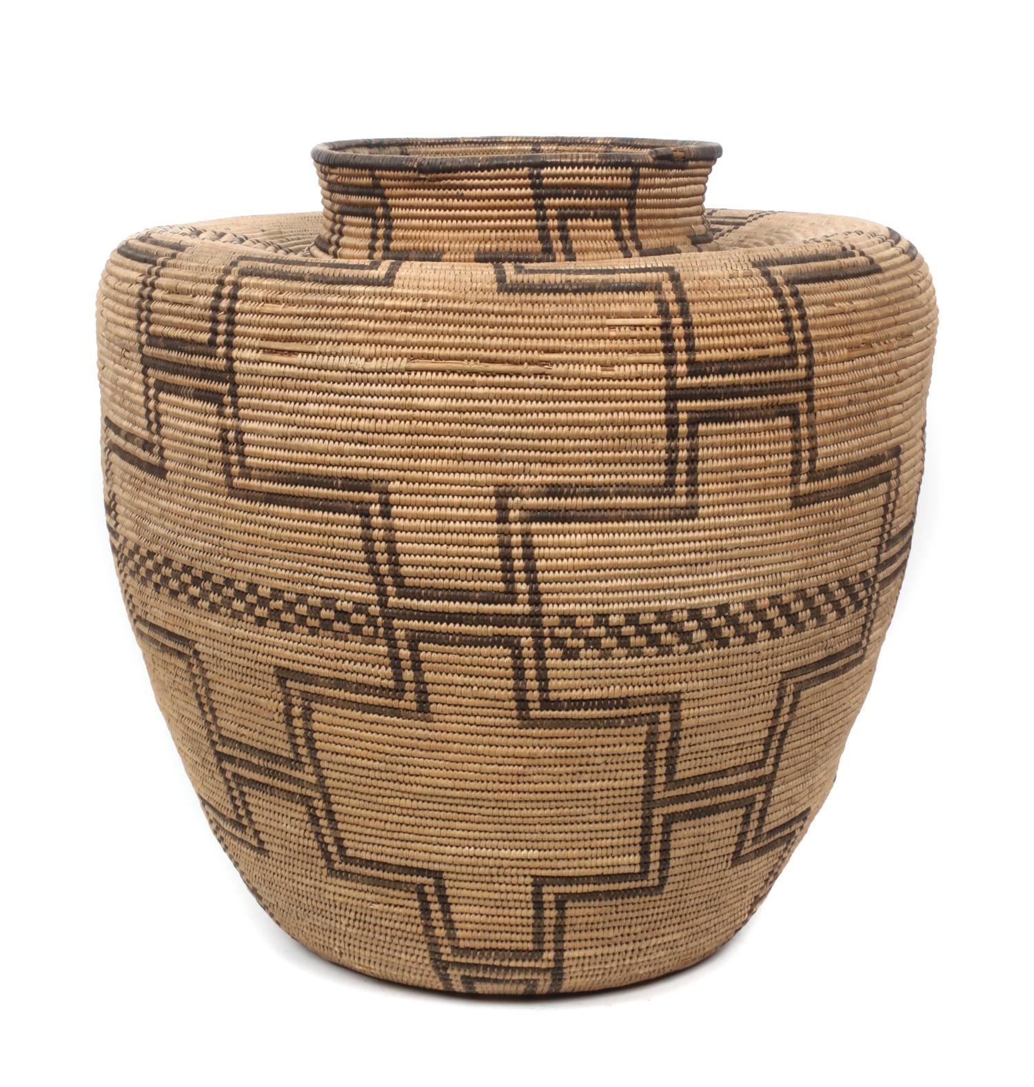 An Apache Basketry Jar Height 15 x diameter 16 inches.