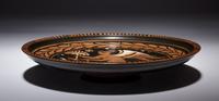 An Apulian Red-Figured Plate with Striding Eros