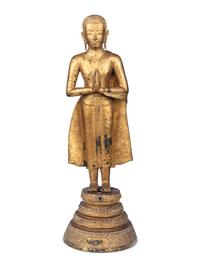 A Gilt Metal Buddha on Stand