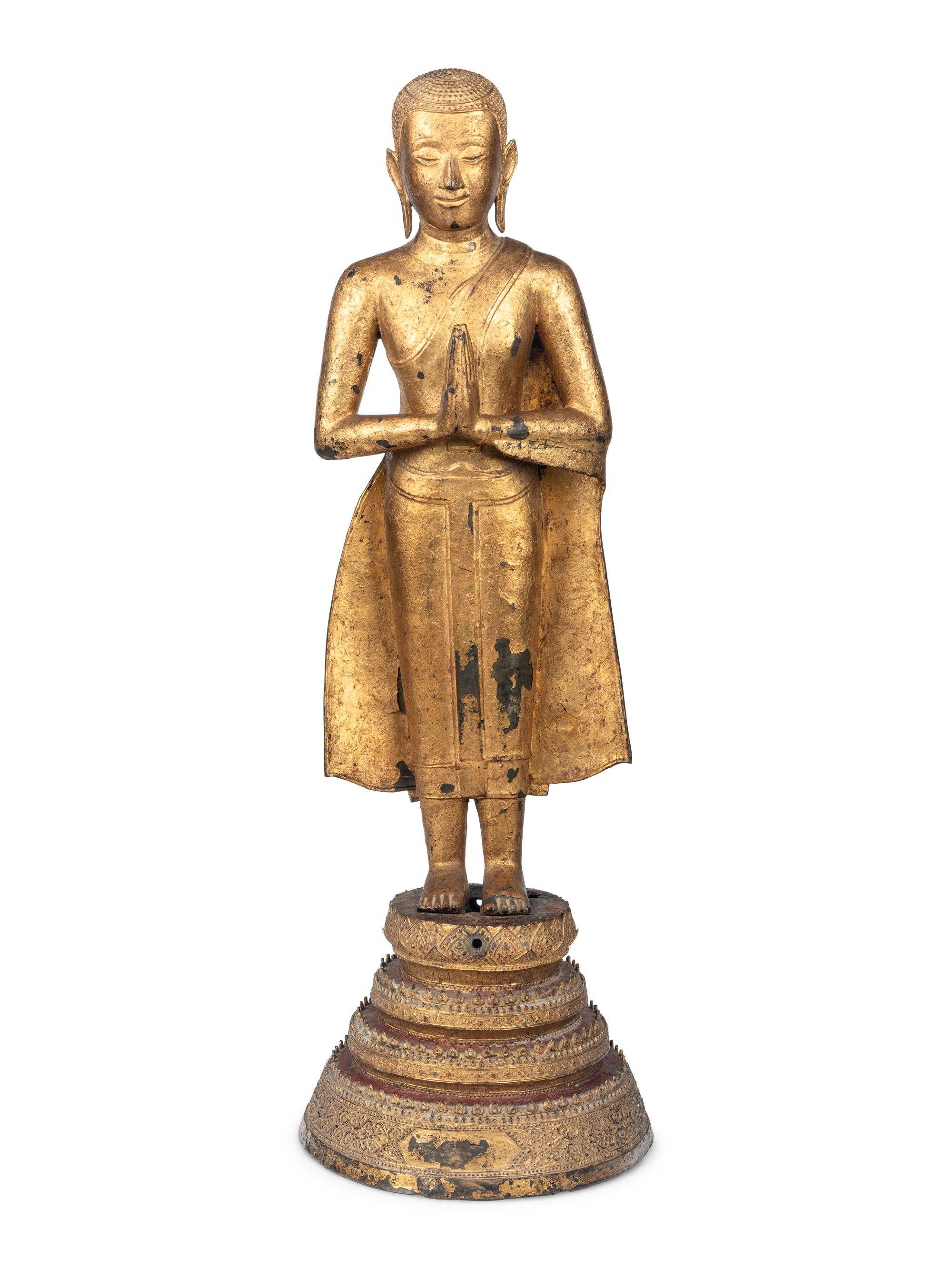A Gilt Metal Buddha on Stand