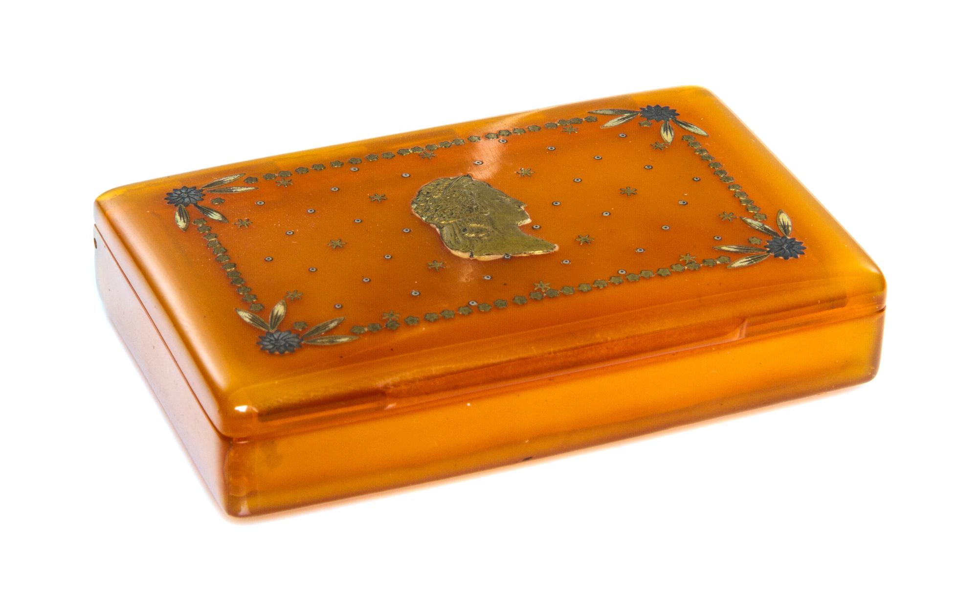 A Silver Inlaid Blond Tortoise Shell Box, 19th Century, of rectangular form, the hinged lid inset with a profile of a classical lady.