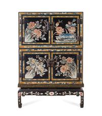 A Chinese Export Lacquered Two-Part Cabinet on Stand