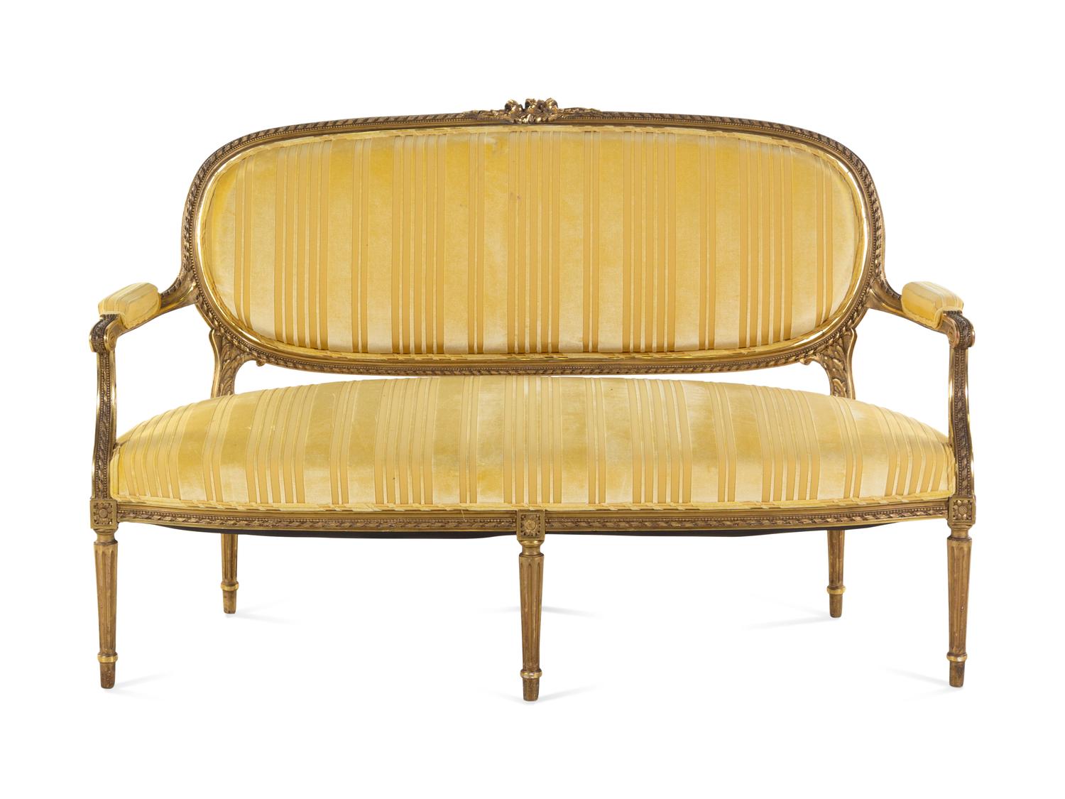 A Louis XVI Style Carved Giltwood Sofa