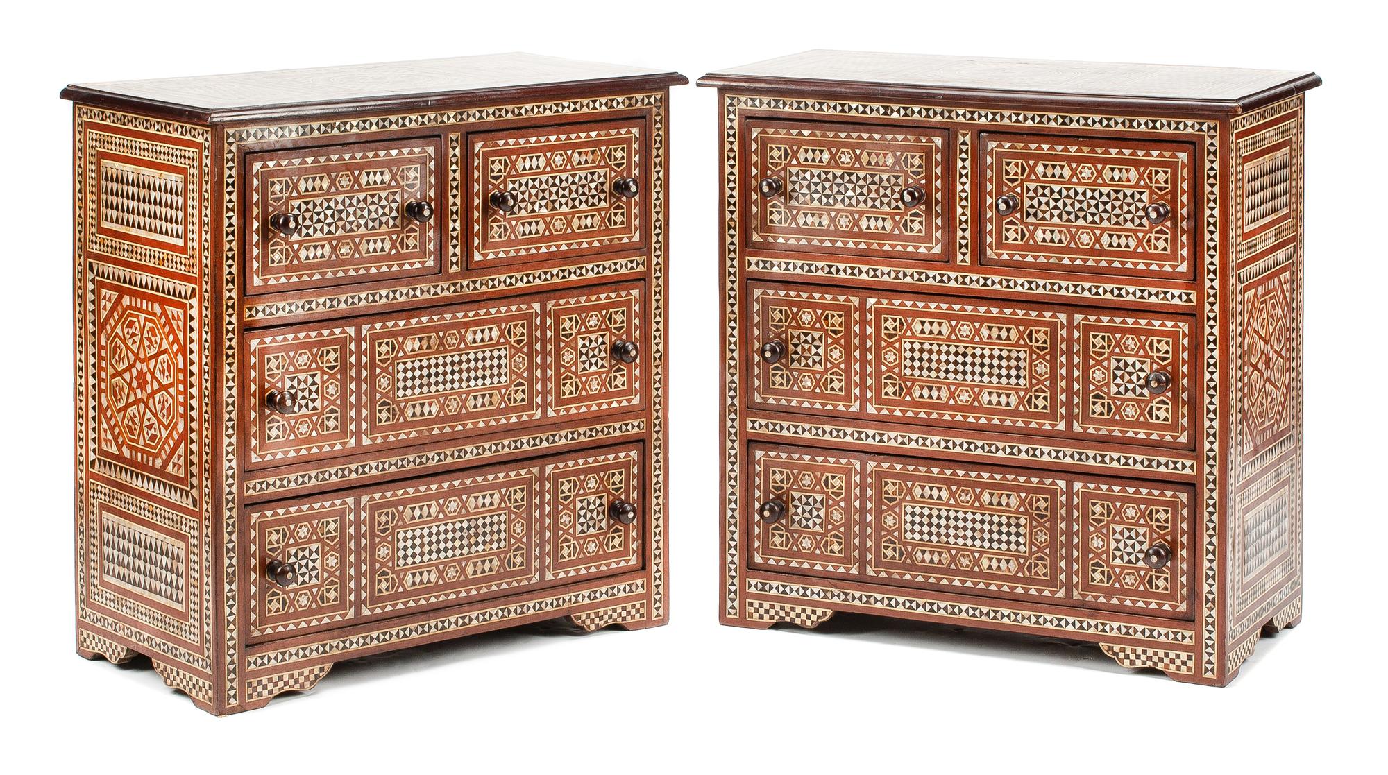 A Pair of Moorish Style Marquetry Chests of Drawers Height 33 1/2 x width 33 x depth 16 1/2 inches.