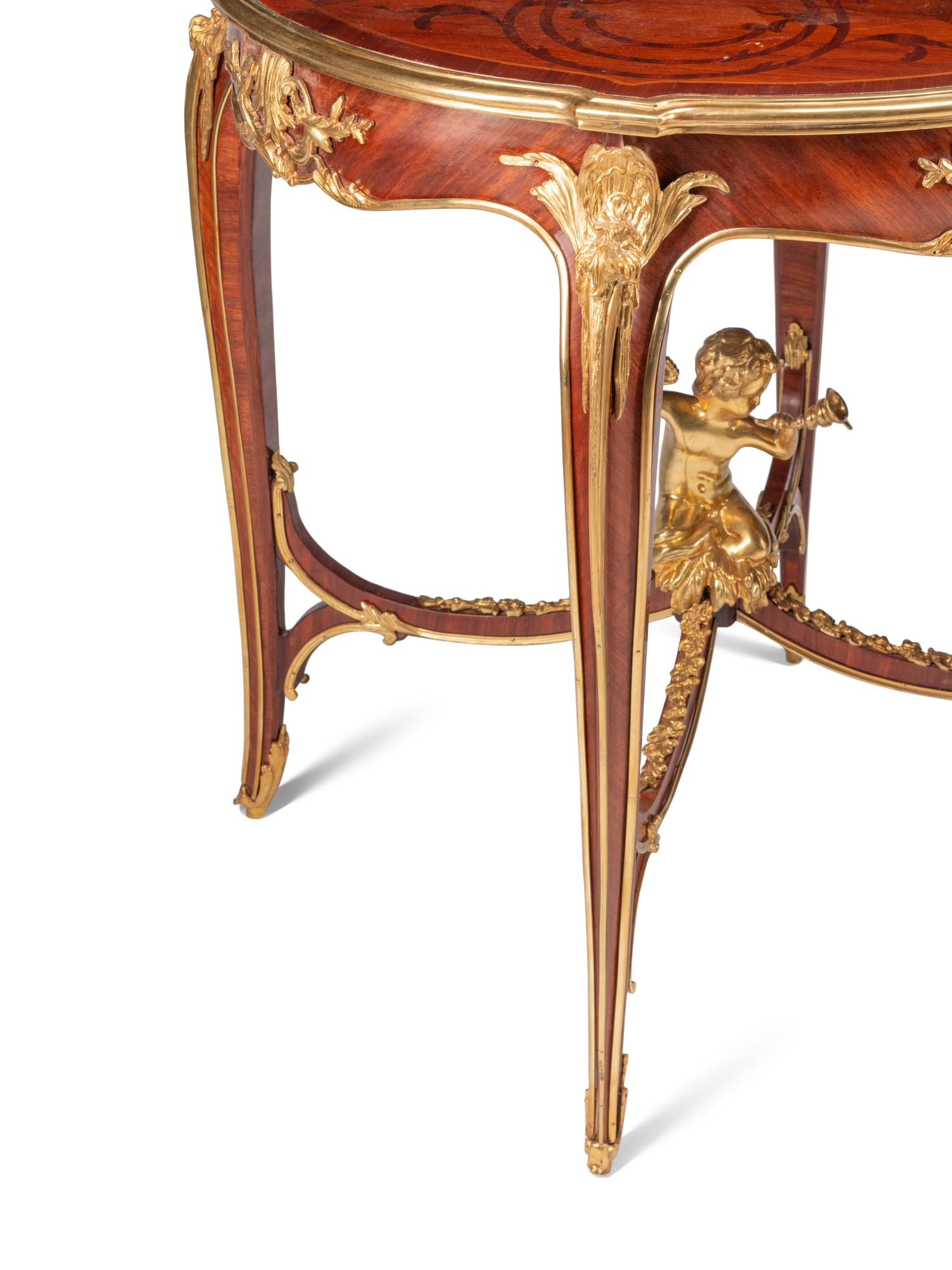 A Pair of Louis XV Style Gilt Bronze Mounted Marquetry and Mahogany Side Tables