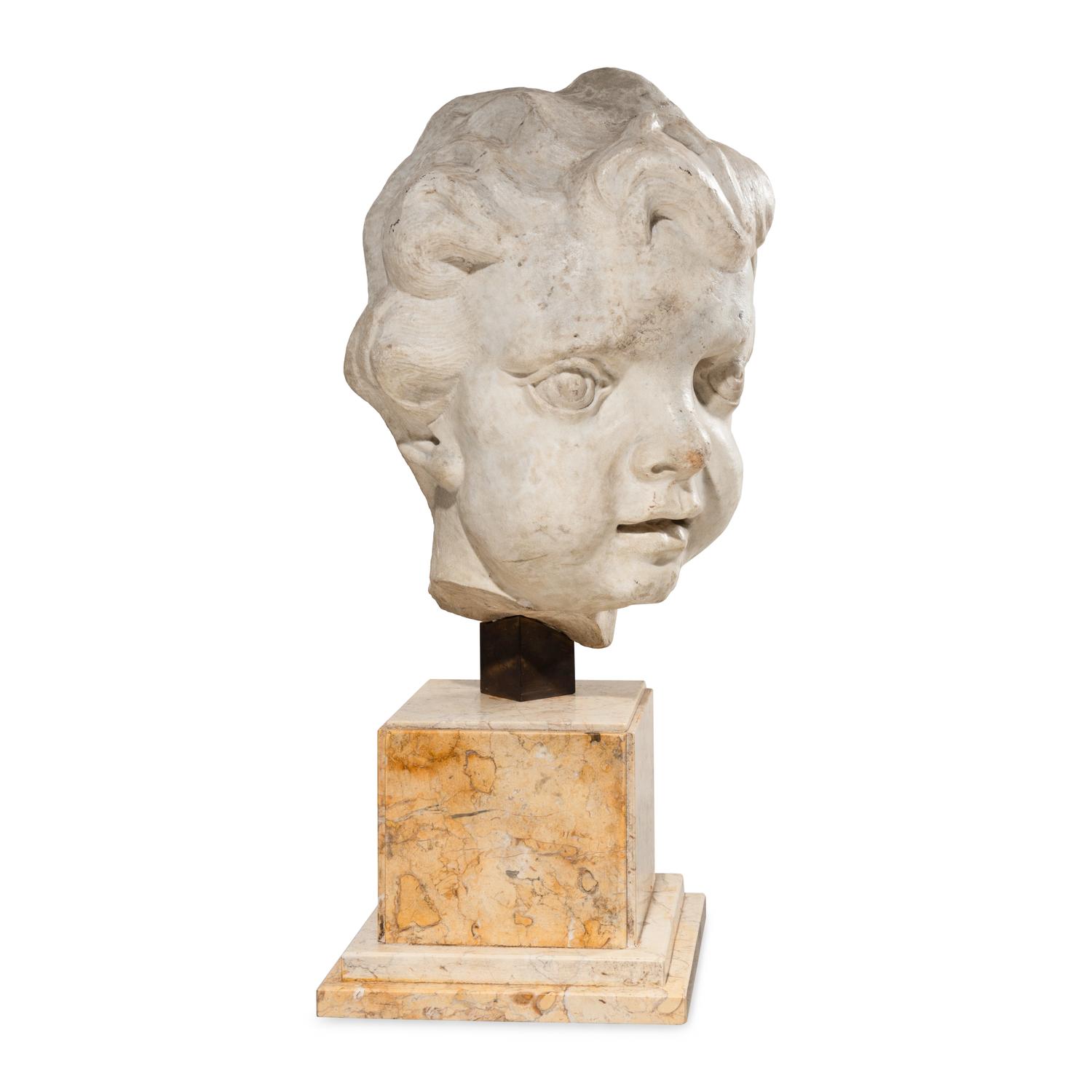 A Large Italian Marble Head of a Putto