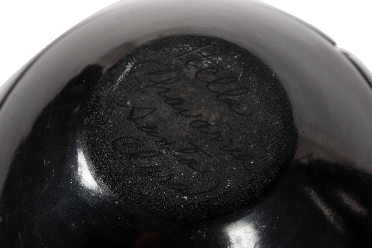 Pair of Carved Blackware Pottery Jars, with Avanyu