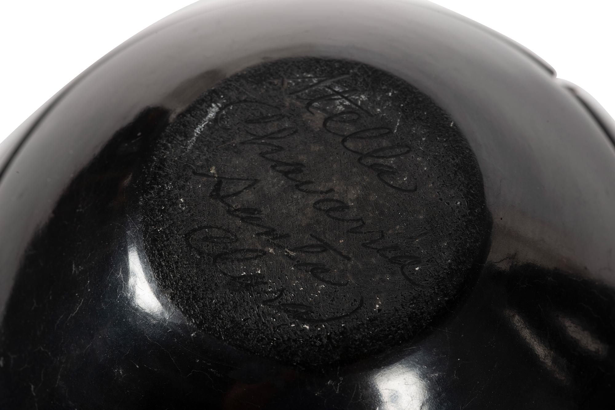 Pair of Carved Blackware Pottery Jars, with Avanyu
