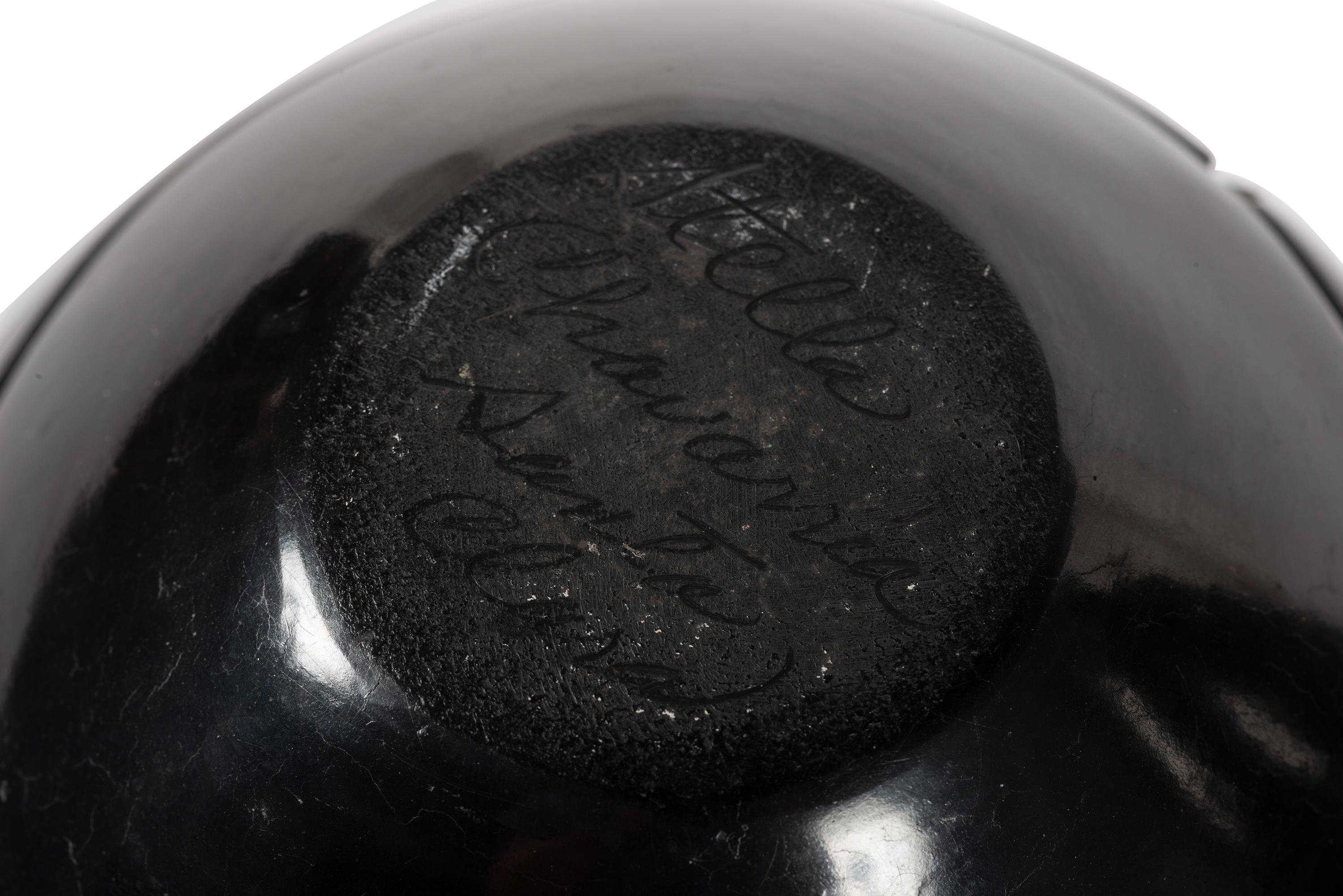 Pair of Carved Blackware Pottery Jars, with Avanyu