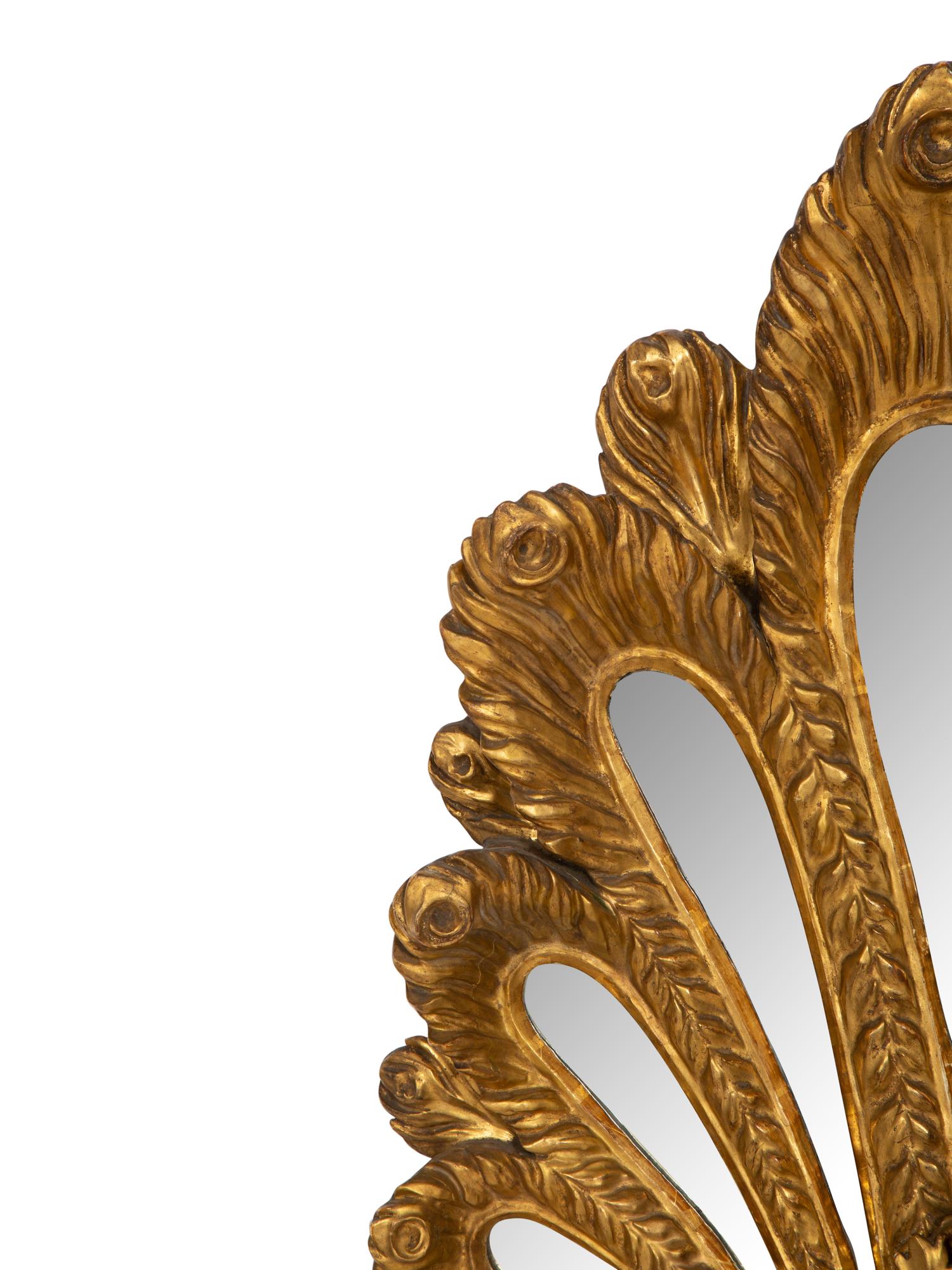 An Italian Giltwood Plume-Form Mirror