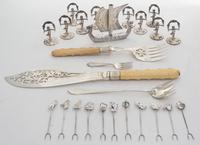 A Collection of Silver and Silver-plate Table Articles, various makers, comprising twelve silver olive picks, ten German silver place c