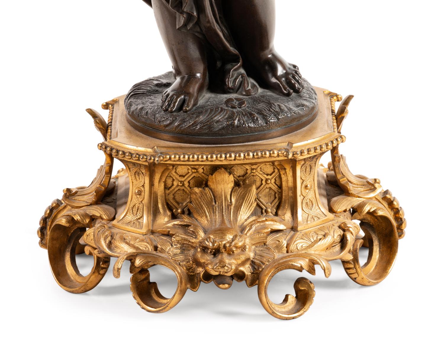 A Louis XV Style Gilt and Patinated Bronze Five-Light Candelabrum