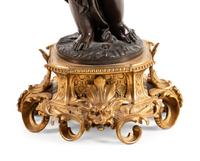 A Louis XV Style Gilt and Patinated Bronze Five-Light Candelabrum