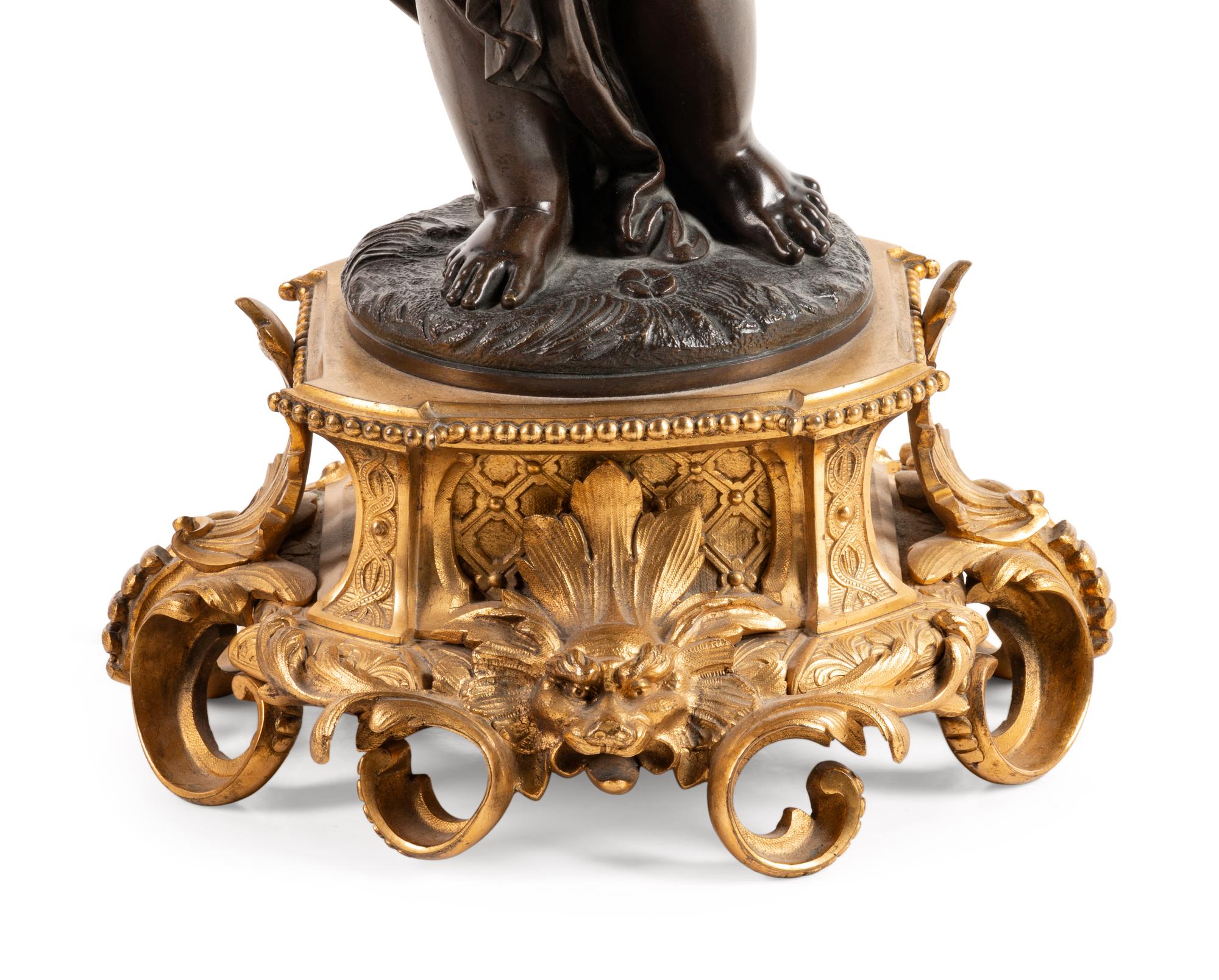 A Louis XV Style Gilt and Patinated Bronze Five-Light Candelabrum