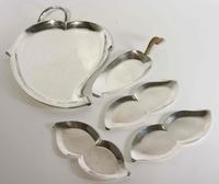 A Group of Five Mexican Silver Serving Trays, Royal Haeger by Royal Hickman, 20th Century, comprising a leaf form tray and four serving