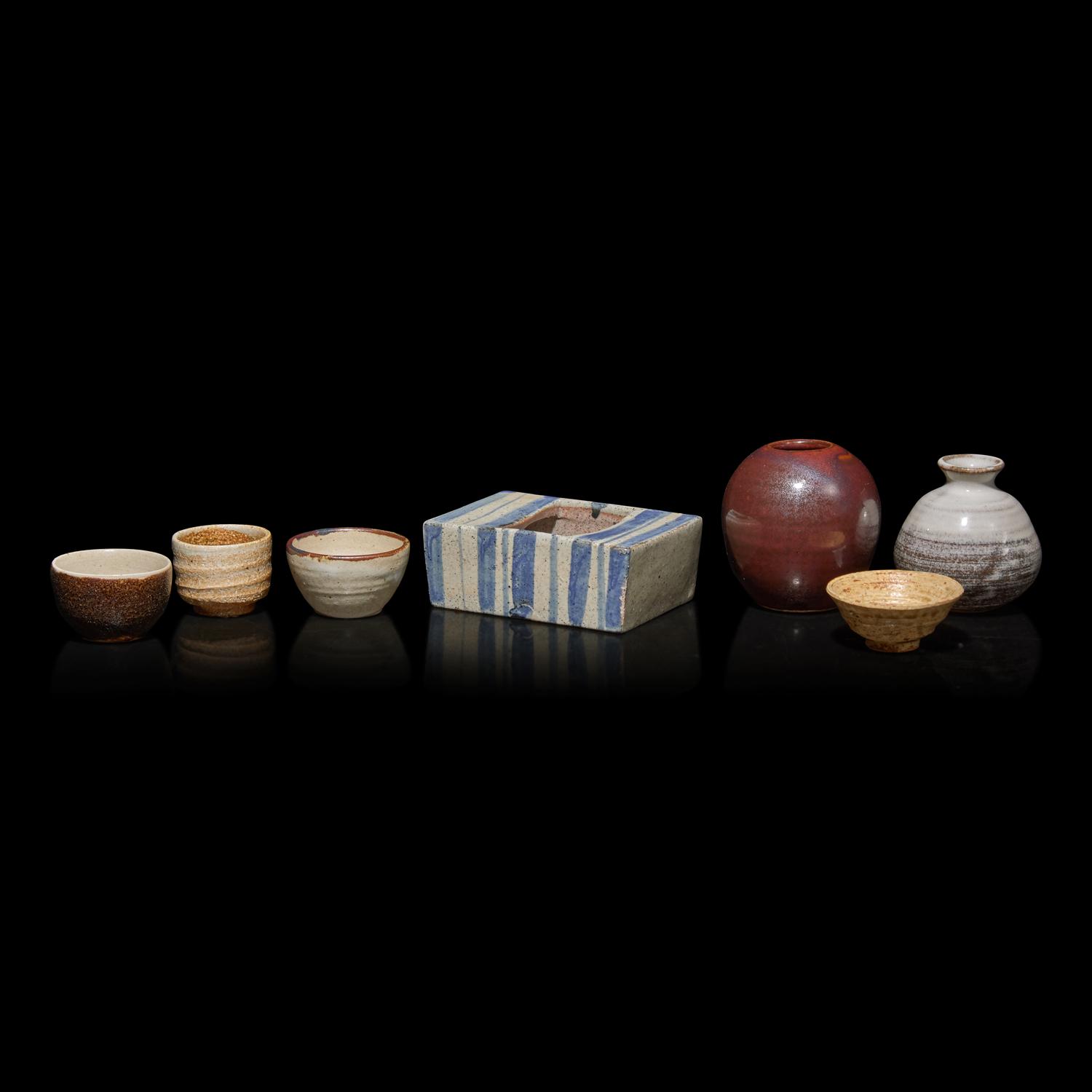 A Group of Seven Assorted Japanese Sake Cups, Small Vases, and a Rectangular Vessel, 20th Century