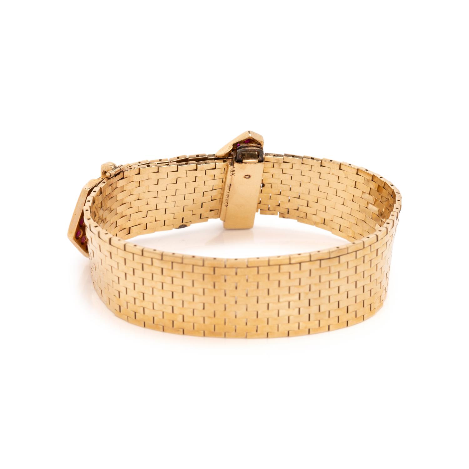 TIFFANY & CO., RETRO, YELLOW GOLD, RUBY AND DIAMOND BELT MOTIF BRACELET