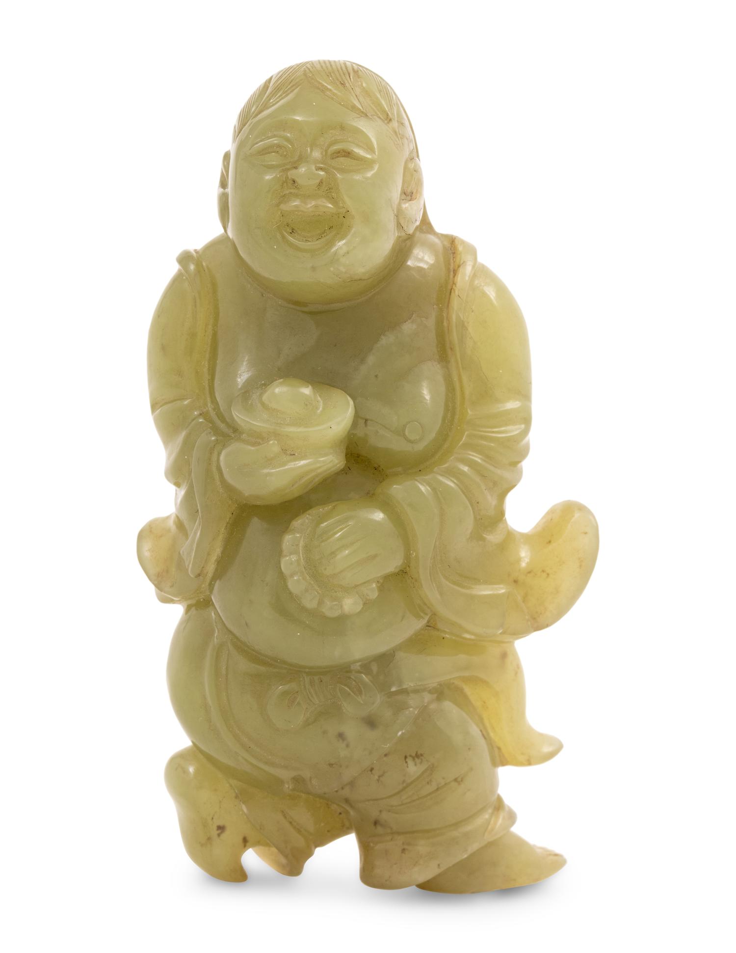 A Chinese Green Jade Figure of an Immortal