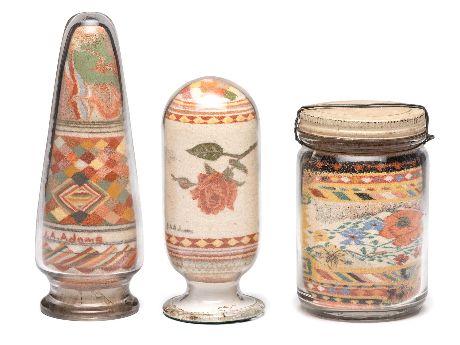 A Collection of John A. Adams Sand Art Bottles, Along with Custom Box and Unused Bottle
